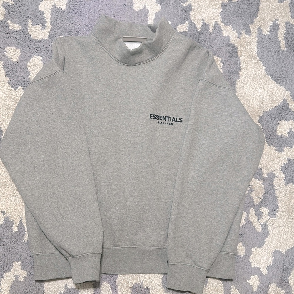 Essentials mock-neck sweater, color is grey and the size is a medium